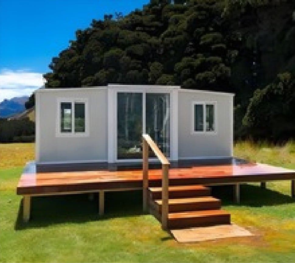 Expandable Home on a large timber deck with stairs and mountain views.