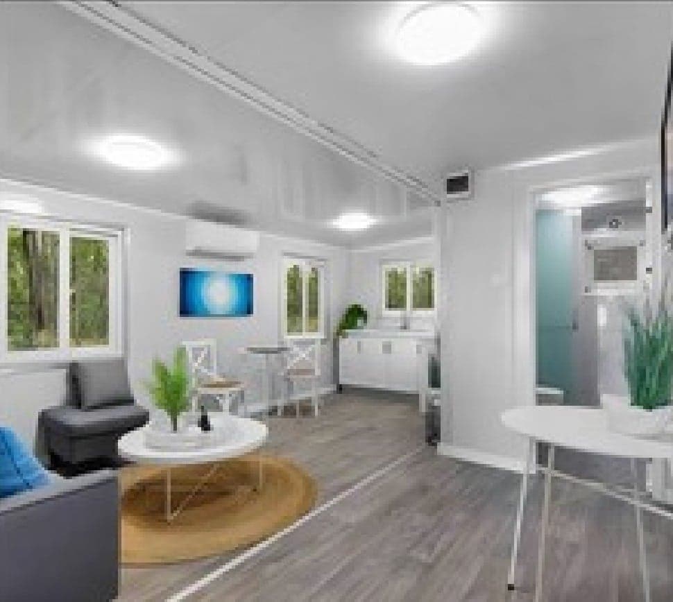 Open-plan living room and kitchen inside an Expandable Home.